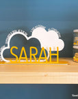 A decorative, customizable, colorful and modern gift for a newborn's or baby's room in the shape of a cloud, personalized to his name. Designed and produced by Steelouette.