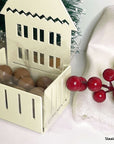 Steelouette Christmas chocolate boxes in the shape of houses, great for decorating your home during the holidays