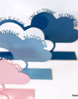 A decorative, customizable, colorful and modern gift for a newborn's or baby's room in the shape of a cloud, personalized to his name. Designed and produced by Steelouette.