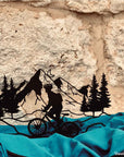 Steel decorative and gift item showcasing a scenic bike ride along the mountains, perfect for outdoor enthusiasts and nature lovers.