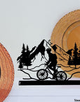 Steel decorative and gift item showcasing a scenic bike ride along the mountains, perfect for outdoor enthusiasts and nature lovers.