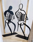 Steel decorative and gift item featuring accordion dancers in action.
