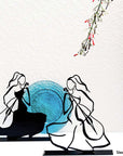 Steel decorative gift item featuring two woman playing on the cello