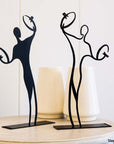 Steel decorative gift item featuring two cymbal players