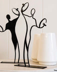 Steel decorative gift item featuring two cymbal players