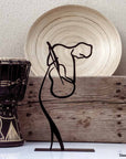 Steel decorative gift item featuring a woman playing guitar