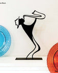steel decorative gift item of a man playing on a trumpet