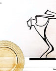 steel decorative gift item of a man playing on a trumpet