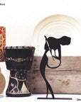 steel decorative gift item of a woman playing on a violin