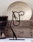 steel decorative gift item of a man playing on a violin