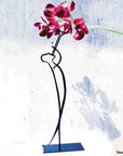 steel decorative gift item of a man playing on a small trumpet