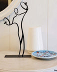steel decorative gift item of a man playing on cymbales