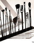 Steel decorative gift item featuring makeup kit brushes