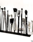 Steel decorative gift item featuring makeup kit brushes