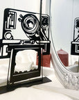 Steel decorative gift item featuring a polaroid camera