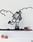 Steel decorative gift item featuring a couple hugging