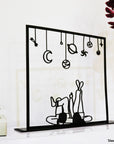 Steel decorative gift item featuring a couple laying on their back and looking at the stars