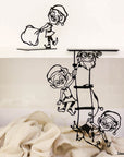 Steel decorative gift item featuring four elves hanging from a ladder