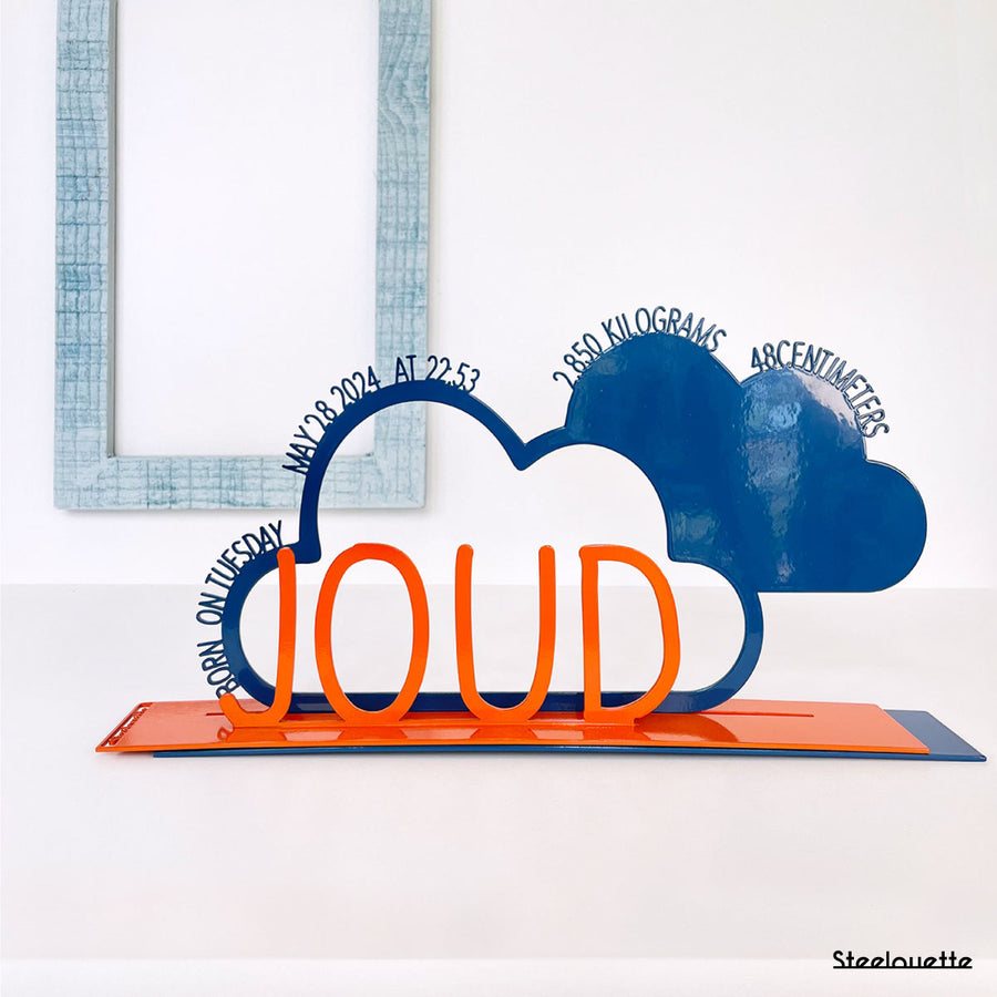 A decorative, customizable, colorful and modern gift for a newborn's or baby's room in the shape of a cloud, personalized to his name. Designed and produced by Steelouette.
