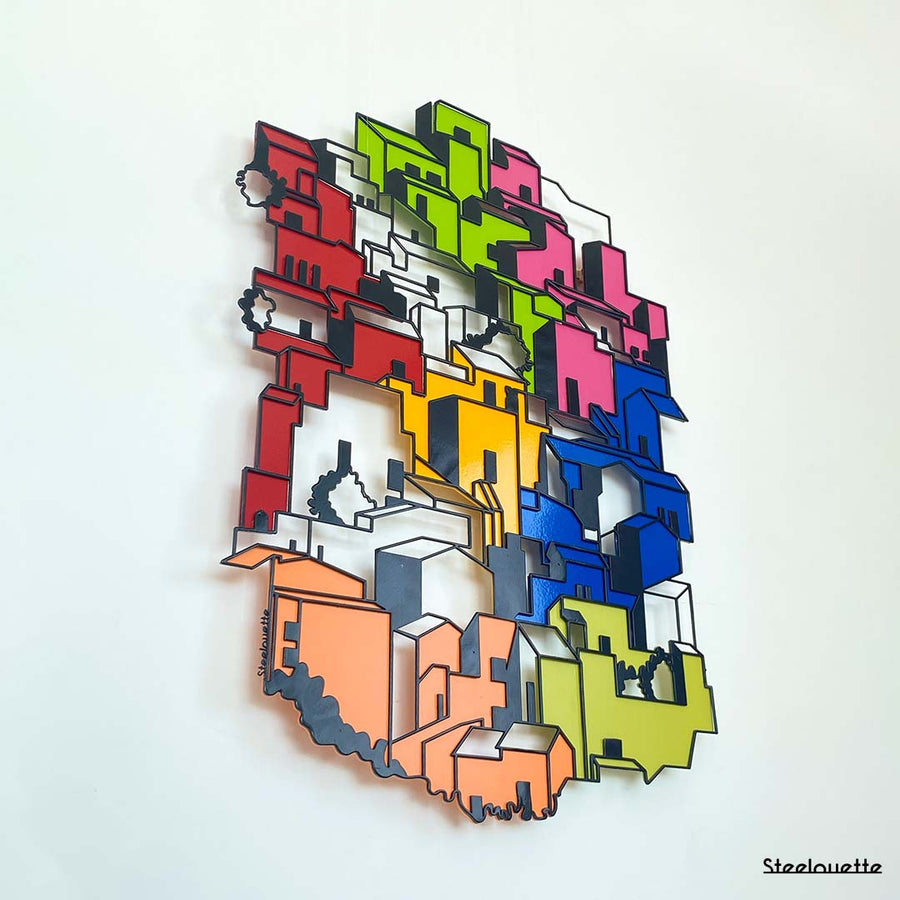 Wall hanged metal product showcasing a city of colorful houses. A great gift idea for your architect friends. A home decoration product by Steelouette.