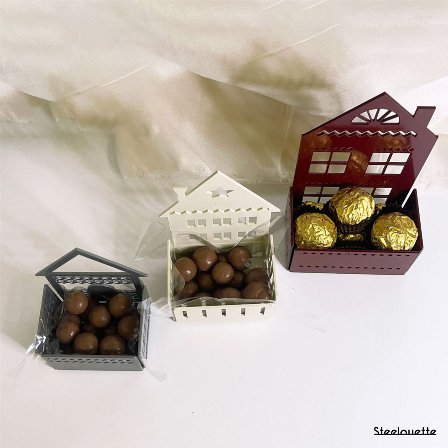 Steelouette Christmas chocolate boxes in the shape of houses, great for decorating your home during the holidays