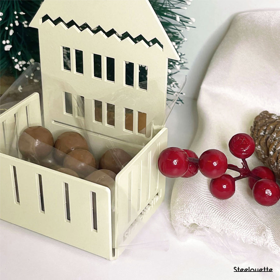 Steelouette Christmas chocolate boxes in the shape of houses, great for decorating your home during the holidays