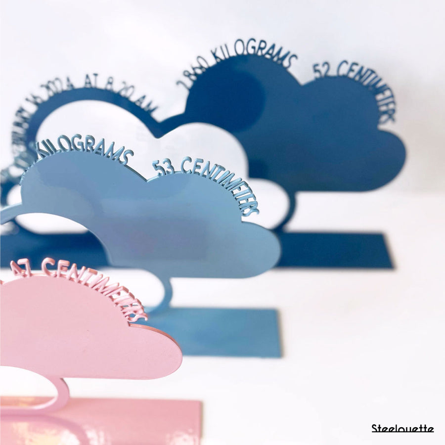 A decorative, customizable, colorful and modern gift for a newborn's or baby's room in the shape of a cloud, personalized to his name. Designed and produced by Steelouette.