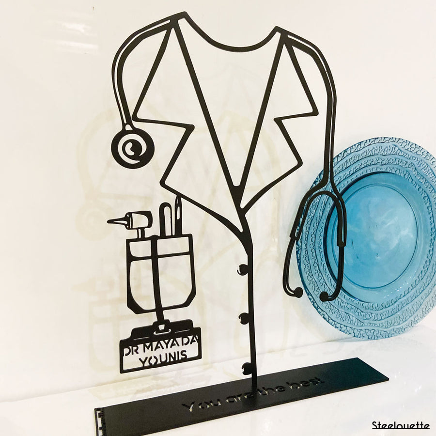 Steel decorative gift item featuring the lab coat of a doctor. A Customized useful gift for a doctor to decorate their office or home. Created by Steelouette.