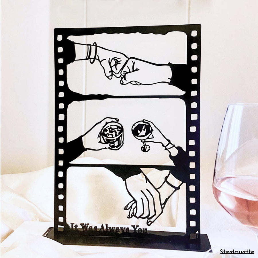 Steel decorative gift item featuring love through holding hands