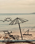steel decorative gift item of a beach, sun, boat, parasol, typical summer day