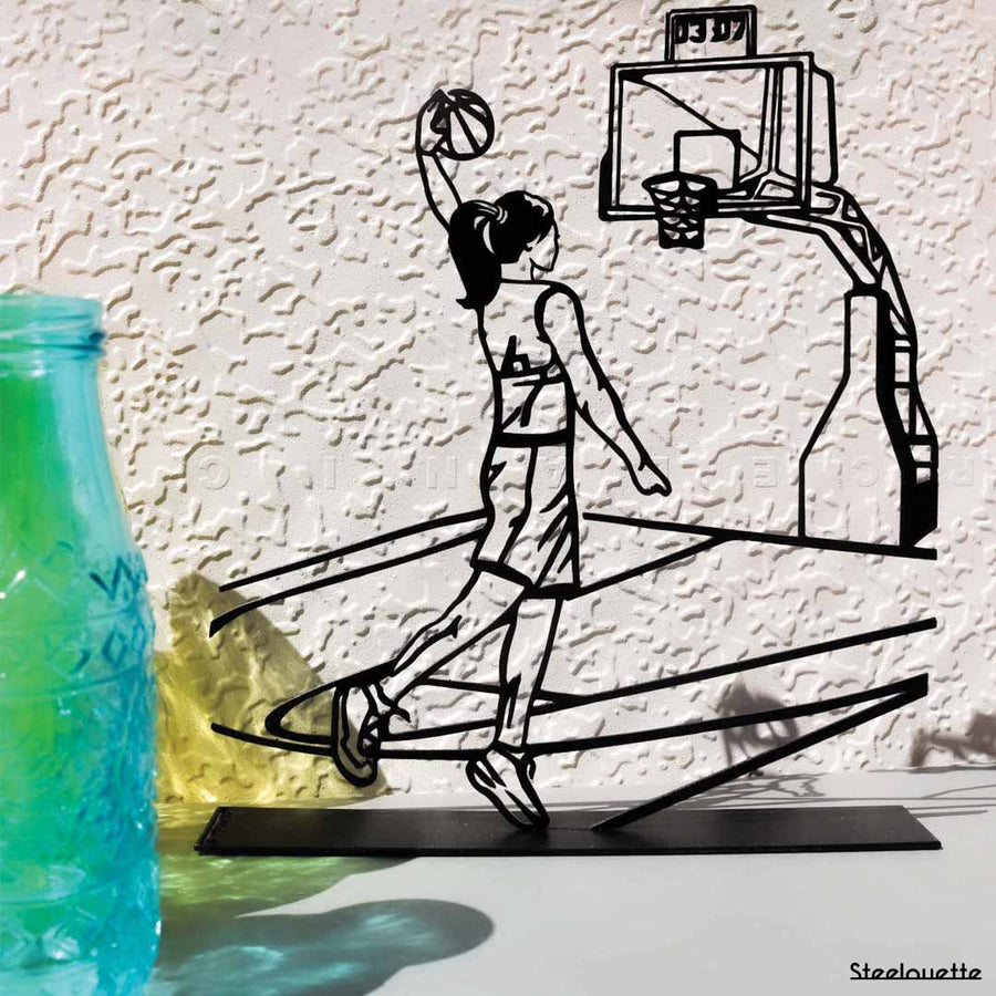 Steel decorative and gift item of a woman playing basketball