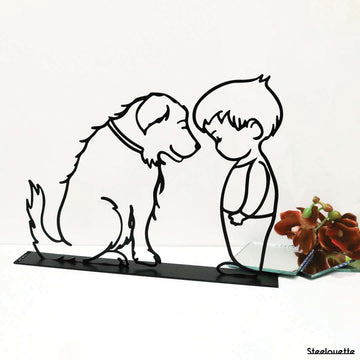 Steel decorative gift item featuring a boy and a dog looking at one another