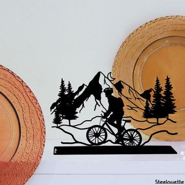 Steel decorative and gift item showcasing a scenic bike ride along the mountains, perfect for outdoor enthusiasts and nature lovers.
