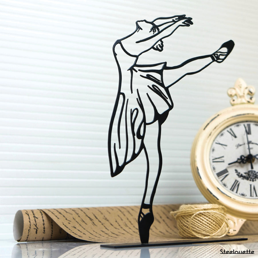 Steel decorative and gift item displaying a ballet dancer performing an arabesque pose.