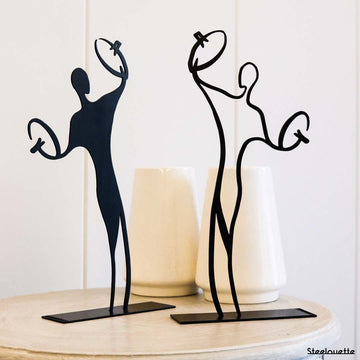 Steel decorative gift item featuring two cymbal players