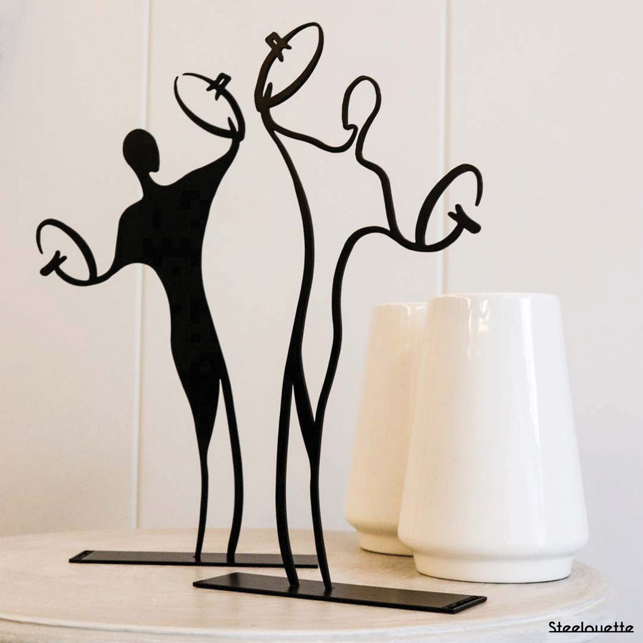 Steel decorative gift item featuring two cymbal players