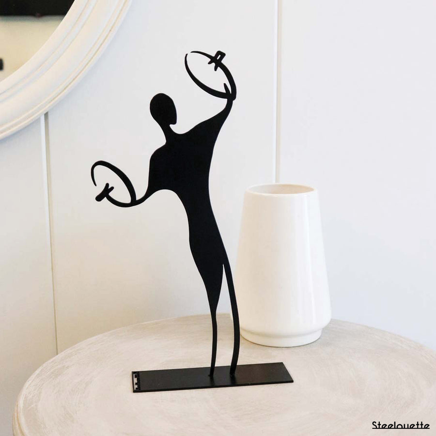 Steel decorative gift item featuring a cymbal player
