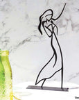 Steel decorative gift item featuring a woman dancing