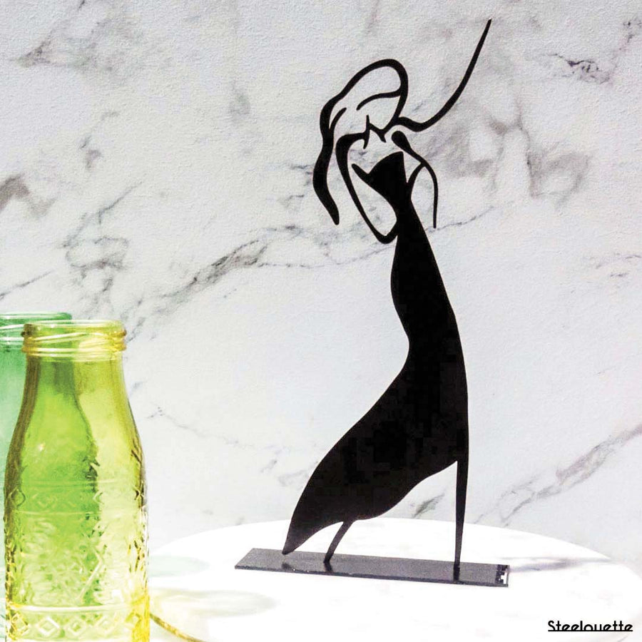 Steel decorative gift item featuring a woman dancing