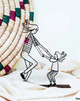 Steel decorative gift item showcasing a mother playing with her daughter