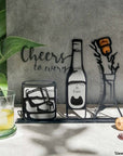 Steel decorative gift item featuring whisky, beer, and champagne... so cheers!