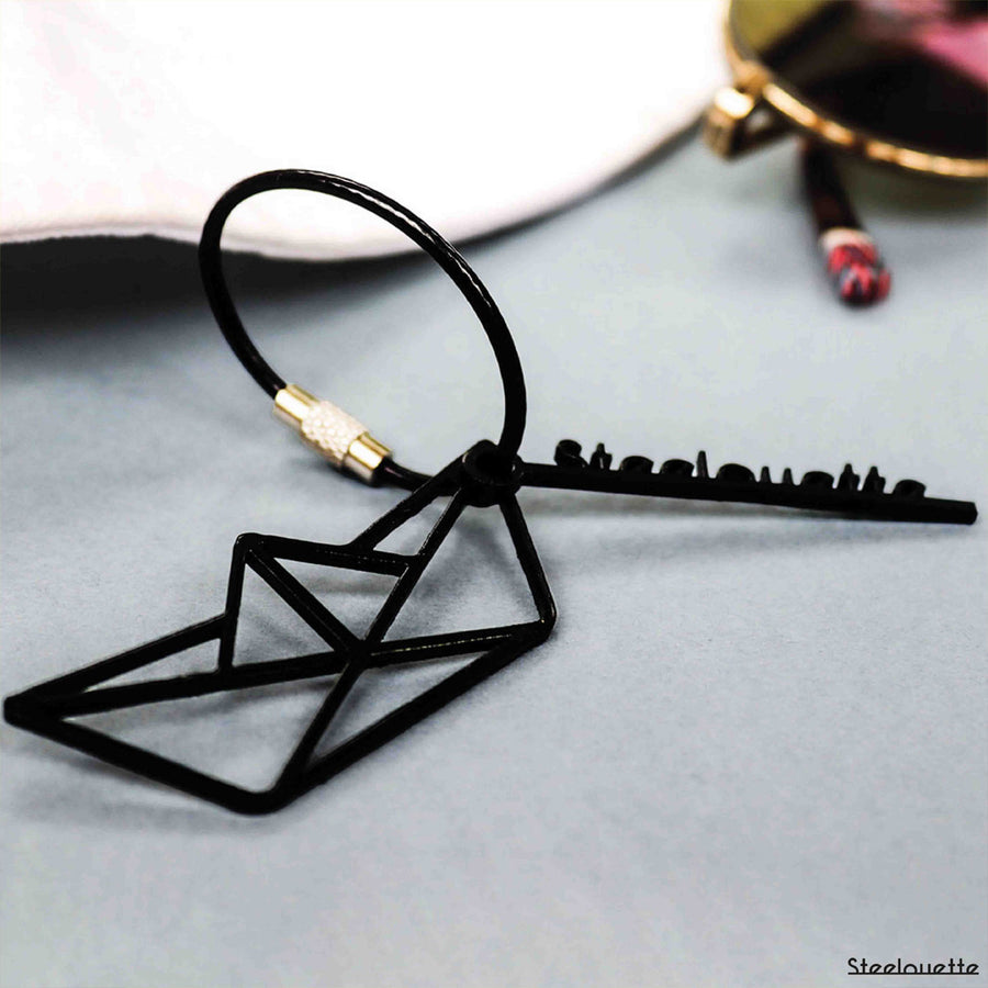 Steel decorative gift keychain in the shape of a paper boat
