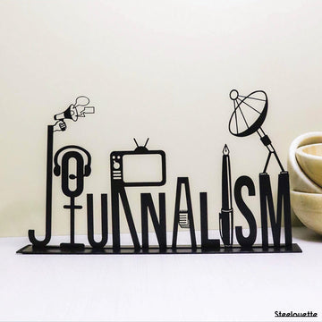 Steel decorative gift item featuring the word journalism.
