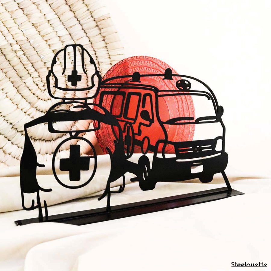 steel decorative gift item of a red cross rescuer and car van