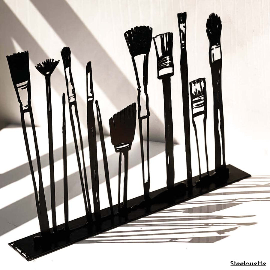 Steel decorative gift item featuring makeup kit brushes
