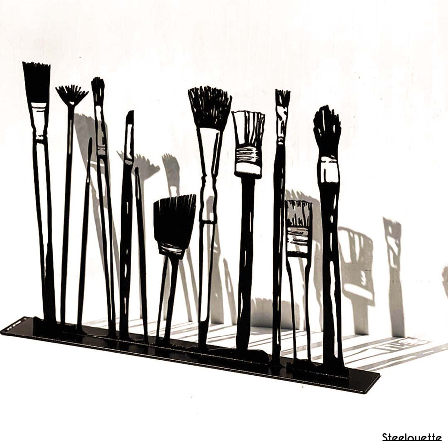 Steel decorative gift item featuring makeup kit brushes