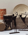Steel decorative and gift item featuring a guy wearing a hat playing on the saxophone