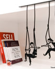 Steel decorative gift item featuring a couple each on a swing