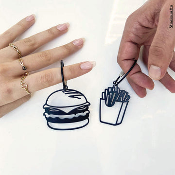 two steel decorative gift keychains of a fries box and a burger