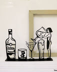 Steel decorative gift item featuring a drink, glasses, and a woman